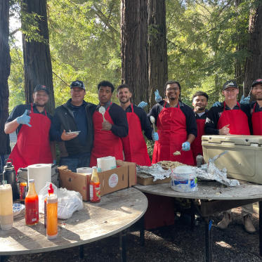 Teammates Serving After Match Meal