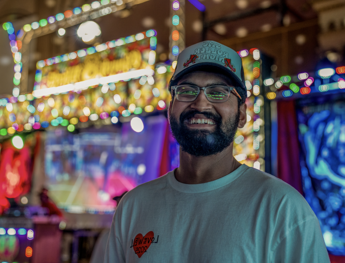 Bright Smile: Advait Powdwal ‘25 smiles for the camera during the SMC Roller Night event co-sponsored by BSU on Friday, Feb 21, 2025. / Photo By Francis Tatem.